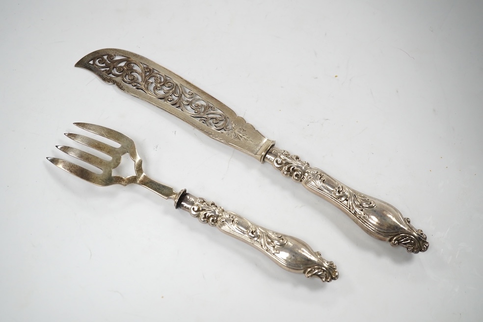 A cased pair of Victorian silver fish servers, John Gilbert?, Birmingham, 1866, knife 31.5cm. Condition - poor